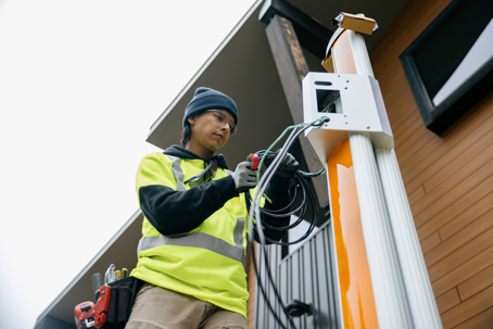 man installing an EV charger