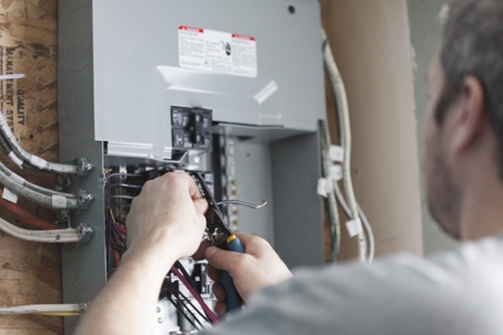 electrician fixing distribution board
